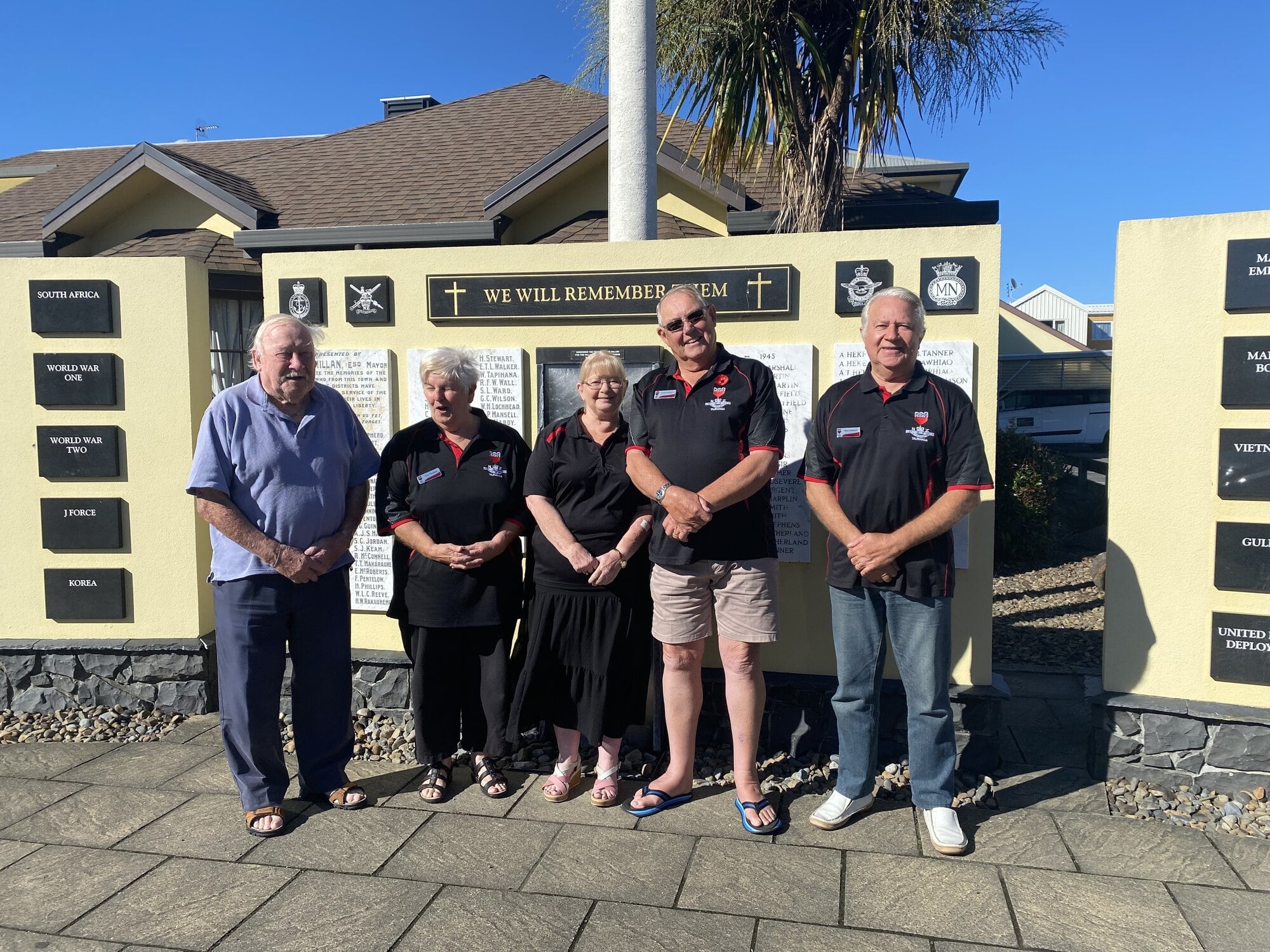 Some of the team at the Tauranga RSA standing in front of the Tauranga RSA Cenotaph on the Cameron Rd site, Fred Milligan (chairman Support Trust), Lyn Thomas (district support adviser), Tricia Hague (district support manager), Duncan Poole (vice-president and local support adviser), and Morton Anderson (president). Photo / Supplied