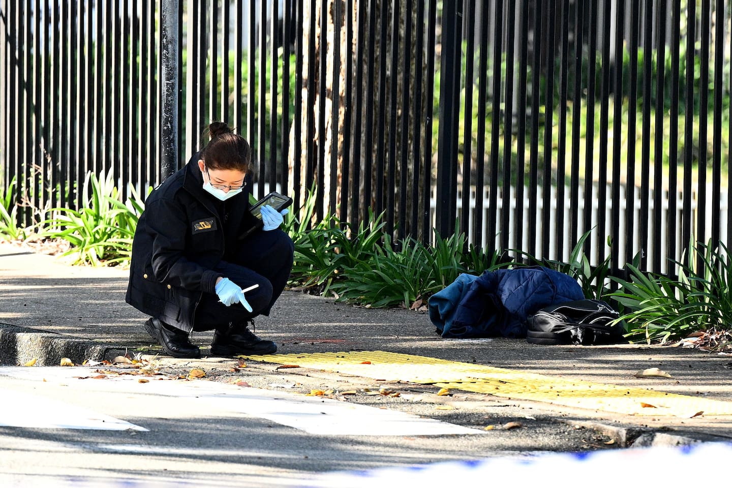 NSW Police and Forensic investigators at the scene of an alleged stabbing at University of Sydney. Photo / AAP