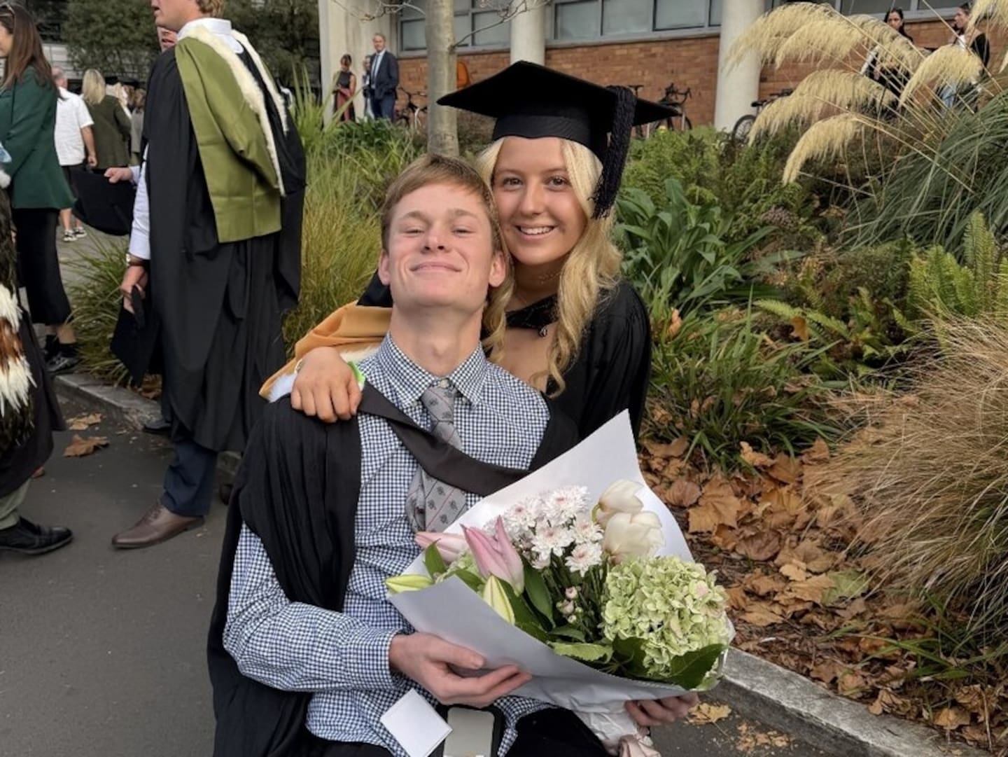 Flynn Mitchell  and Jemima Hawkesby on graduation day.