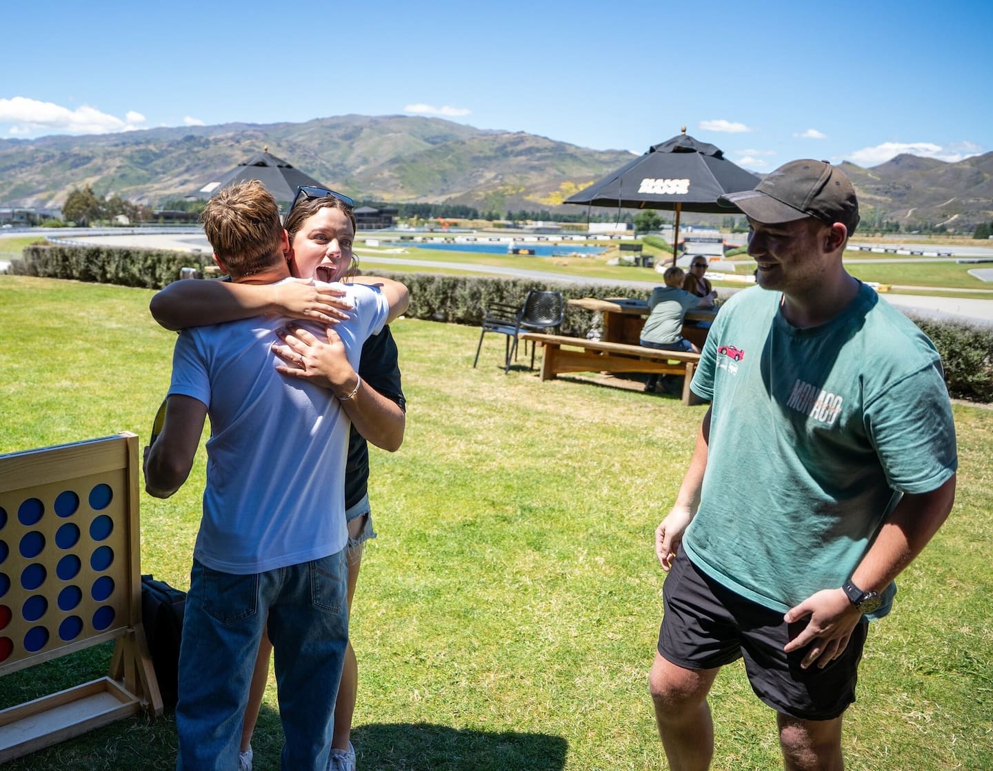 Liam Lawson, left, was a surprise addition to the celebrations after the marriage proposal of Christchurch couple Zoe Kenny and Jayden Butler at Highlands Motorsport Park in Cromwell. Photo / Facebook, HighlandsNZ