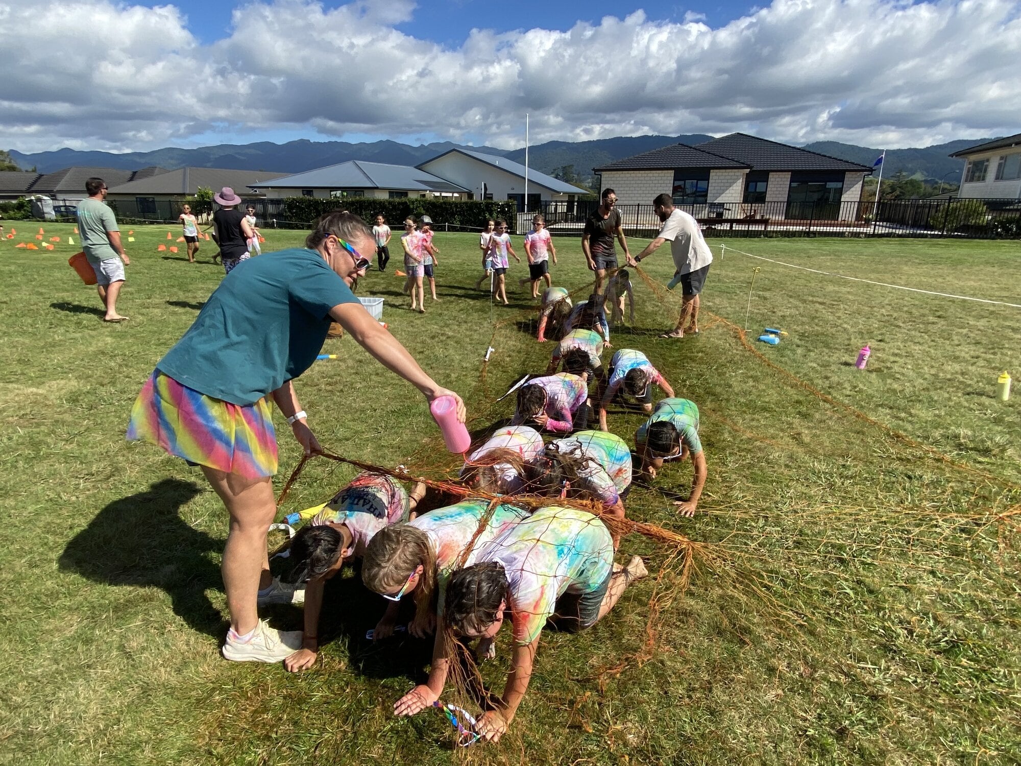  Teacher Kirsty Graveson colouring students as they navigate the cargo net. Photo / Merle Cave