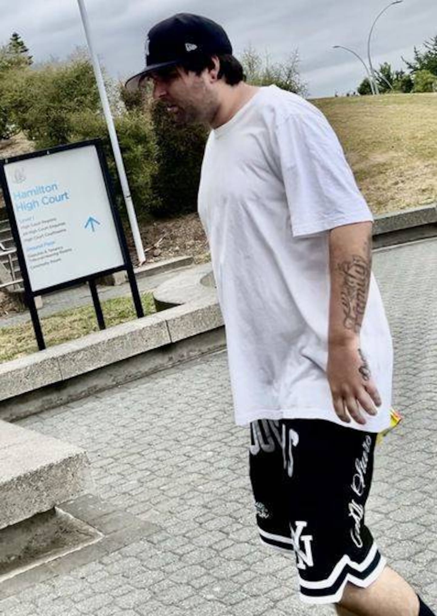 Dylan Cossey, 27, enters the Hamilton District Court for sentencing on three charges on Tuesday morning. Photo / Belinda Feek