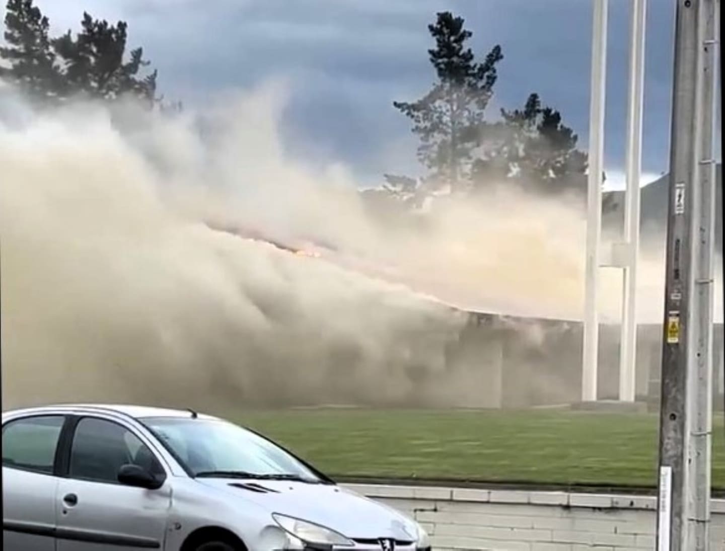 The building was engulfed in flames and smoke.