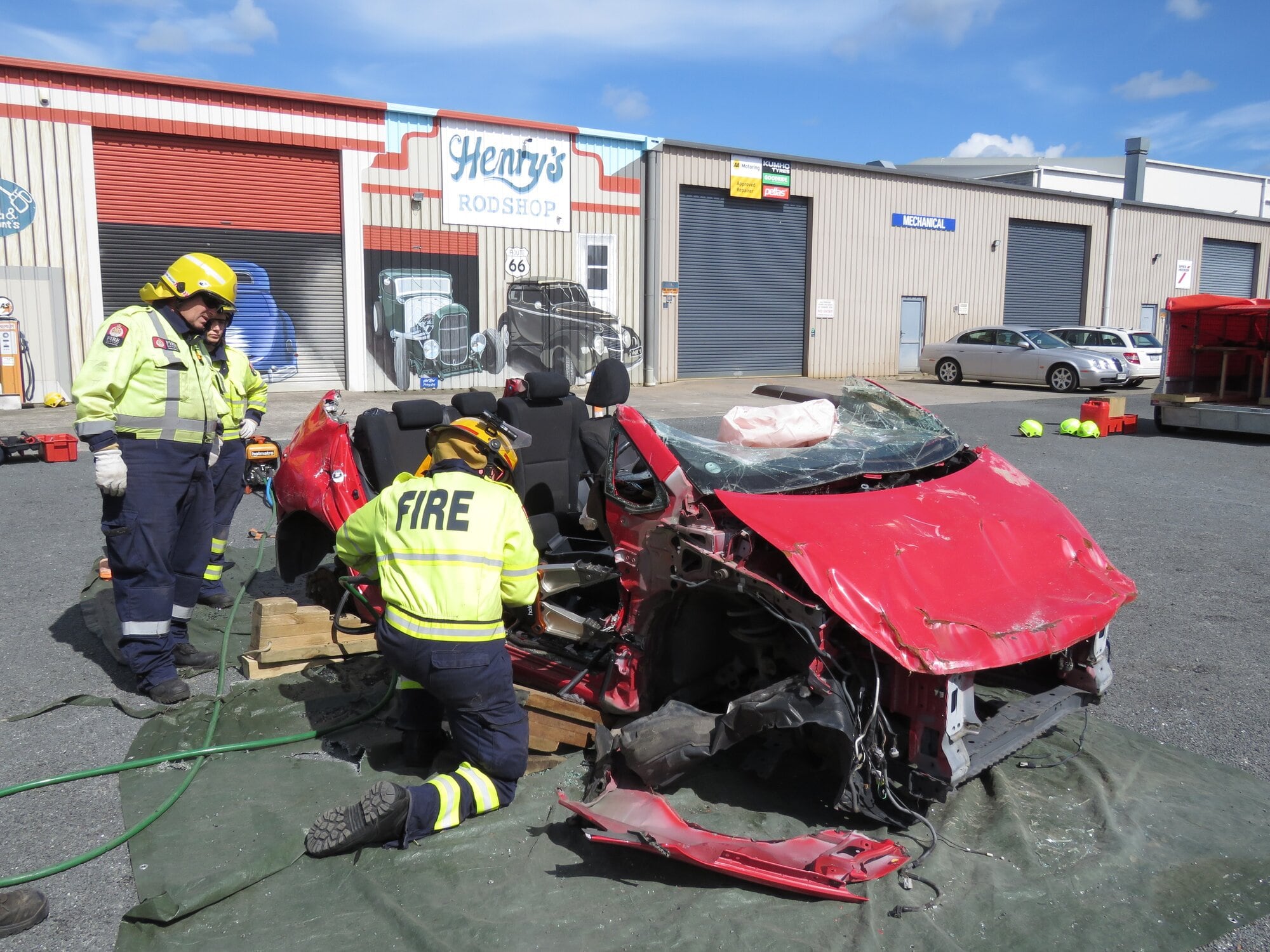  Three firefighters learning how to use rescue tender equipment on the recent MVE course in Katikati. Photo / Merle Cave
006: need name ….. Photo / Merle Cave