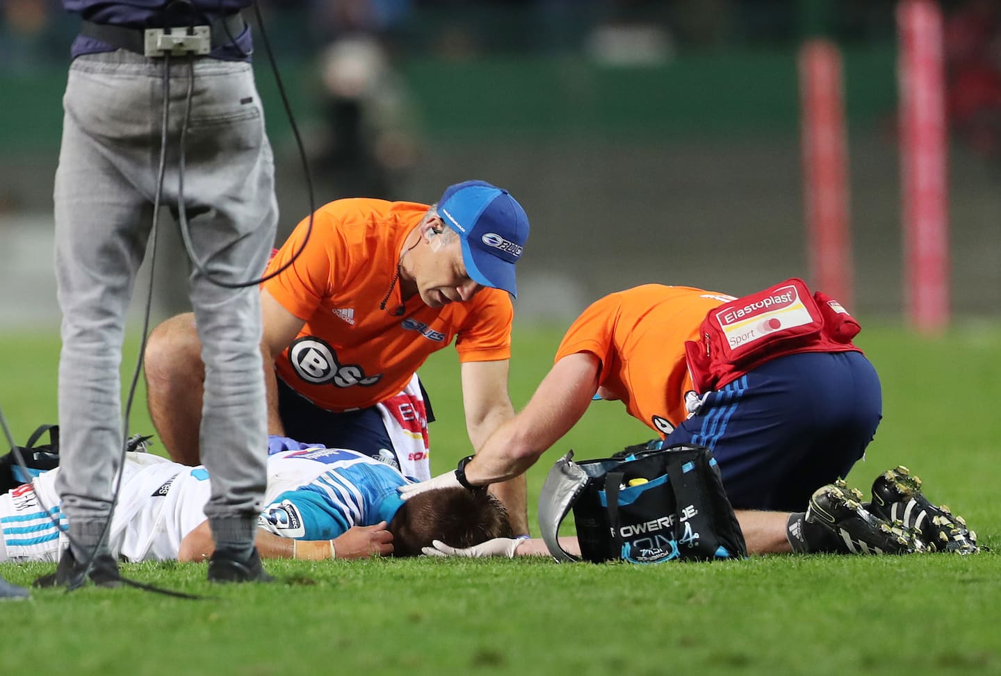A player is treated for a head injury. Photo / Photosport