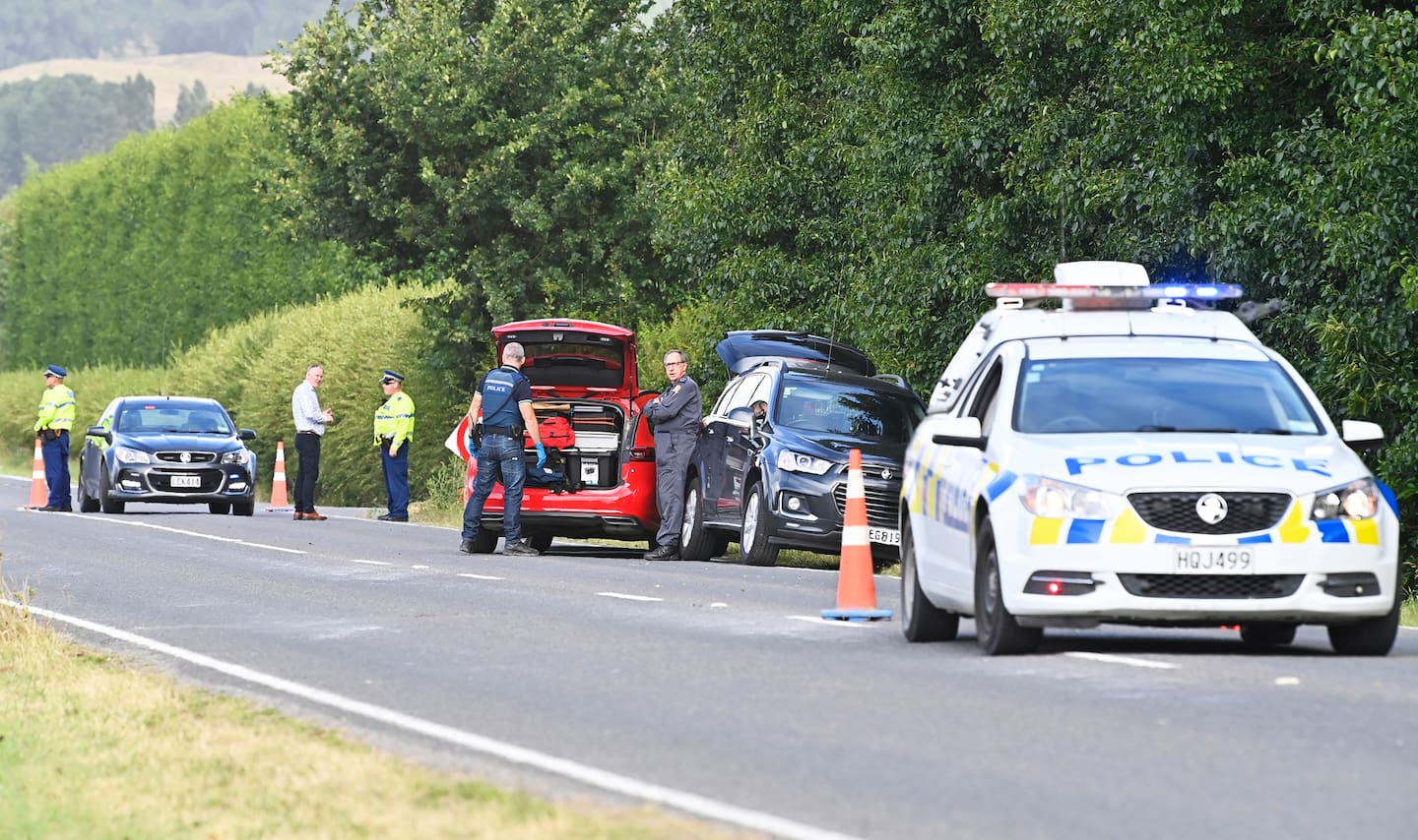 Police gather on a road near Gisborne after the body of Fletcher Wong was discovered.
Photo / Gisborne Herald