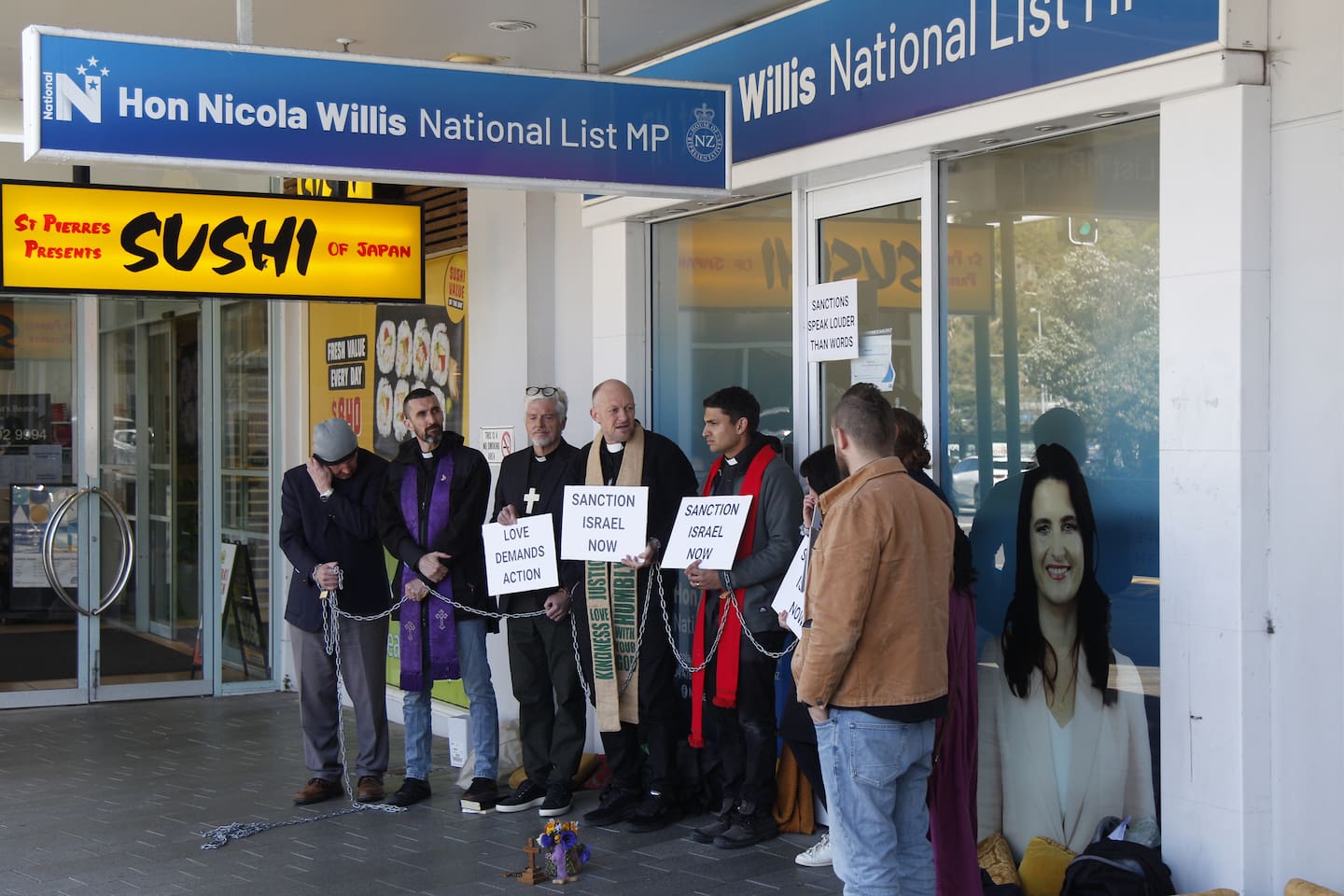 Priests have chained themselves to Nicola Willis' office over Gaza. Photo / Ethan Manera