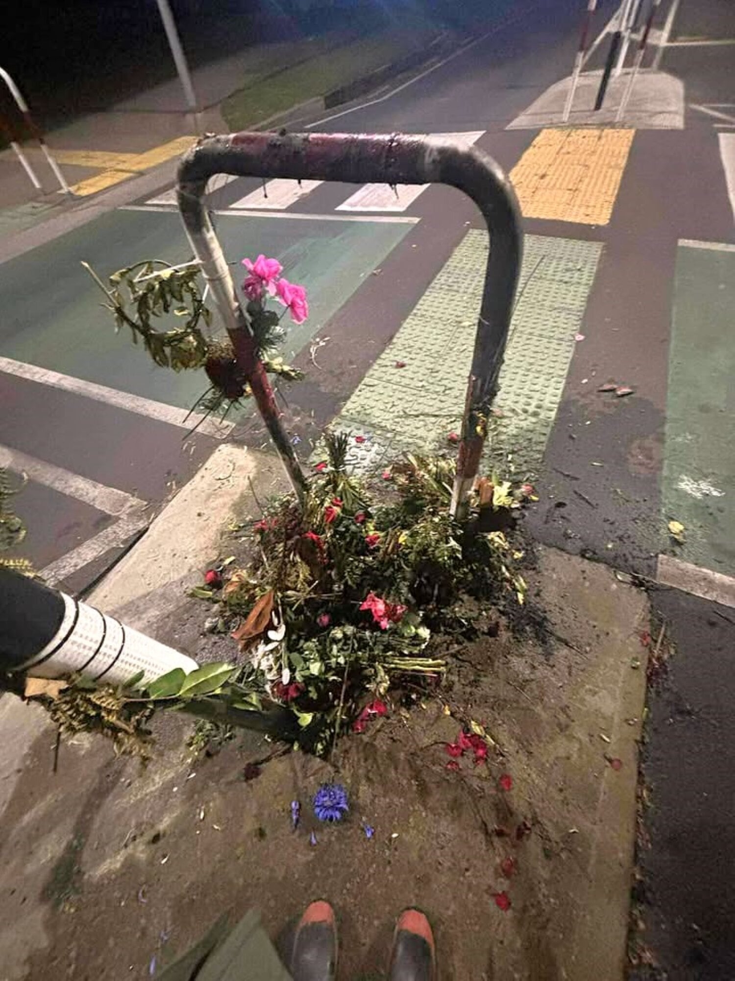 A flower tribute for Paige Johnson who was killed after an alleged hit and run was destroyed in fire last night. Photo / Supplied 