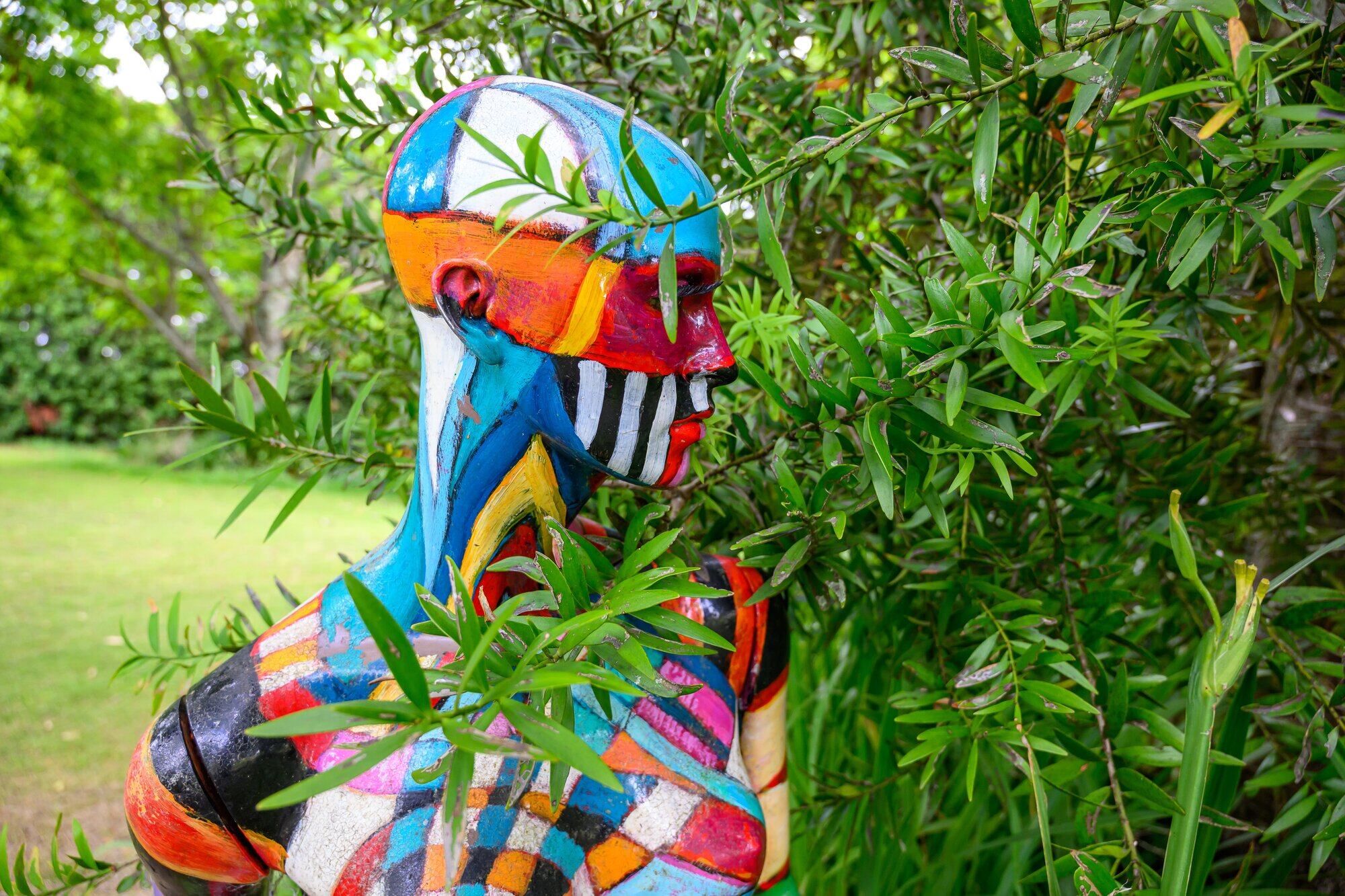 A colourful mannequin by New Zealand artist Sue Lund installed on the grounds of Jens Mueller&rsquo;s rural property in Pyes Pā. Photo / David Hall