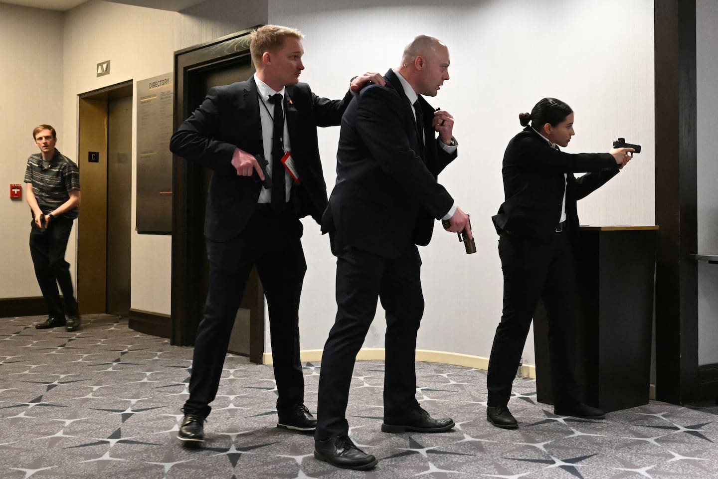 Agents draw their guns after loud bangs were heard during the White House Correspondents' dinner at the Washington Hilton in Washington, DC, on April 25, 2026. Photo / AFP