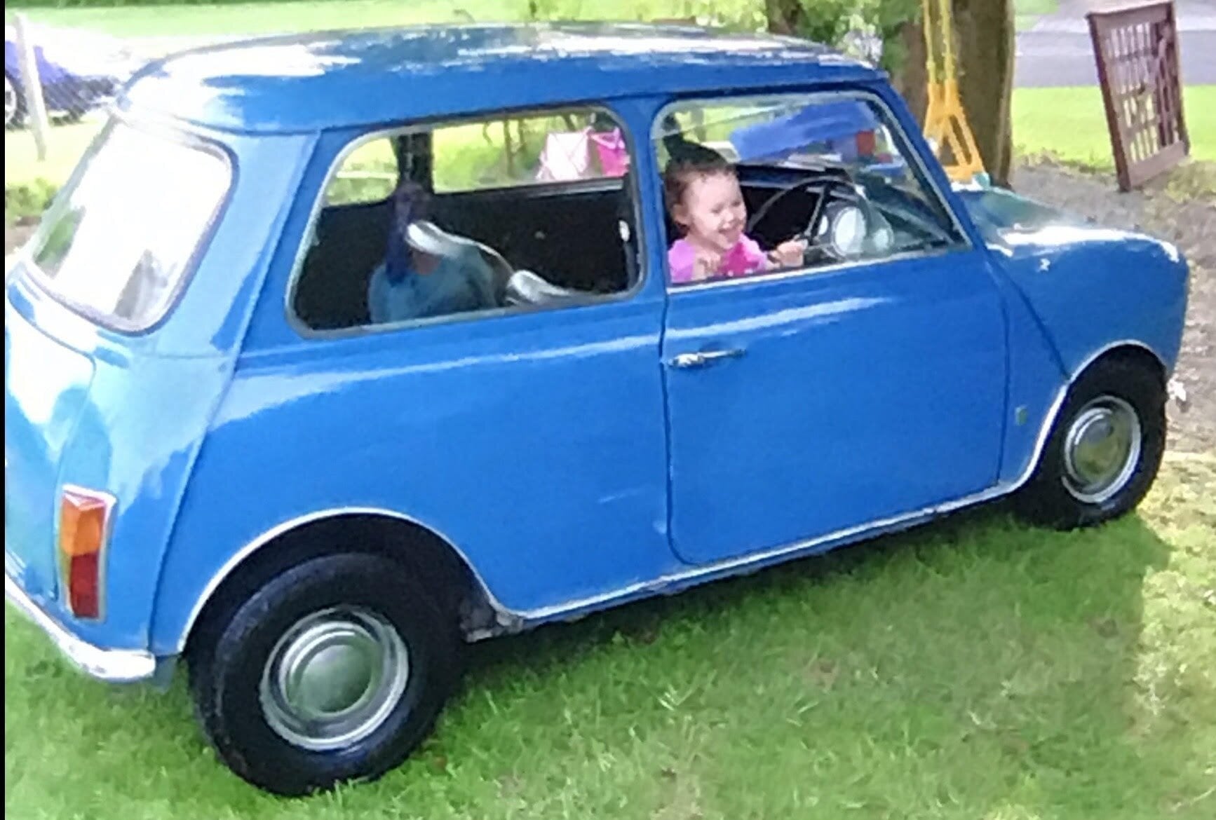  Paige aged 2 in the Mini that she, her dad and grandpa restored together. Photo / Supplied