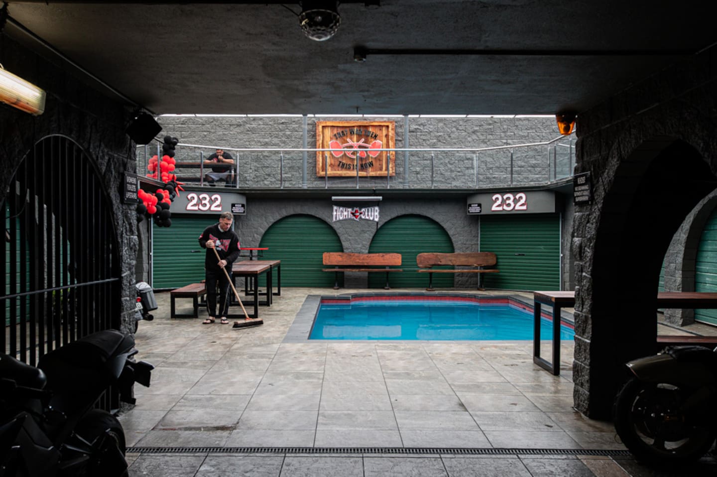 A member sweeps the floor beside the pool inside Marua Rd. Photo / Jason Dorday