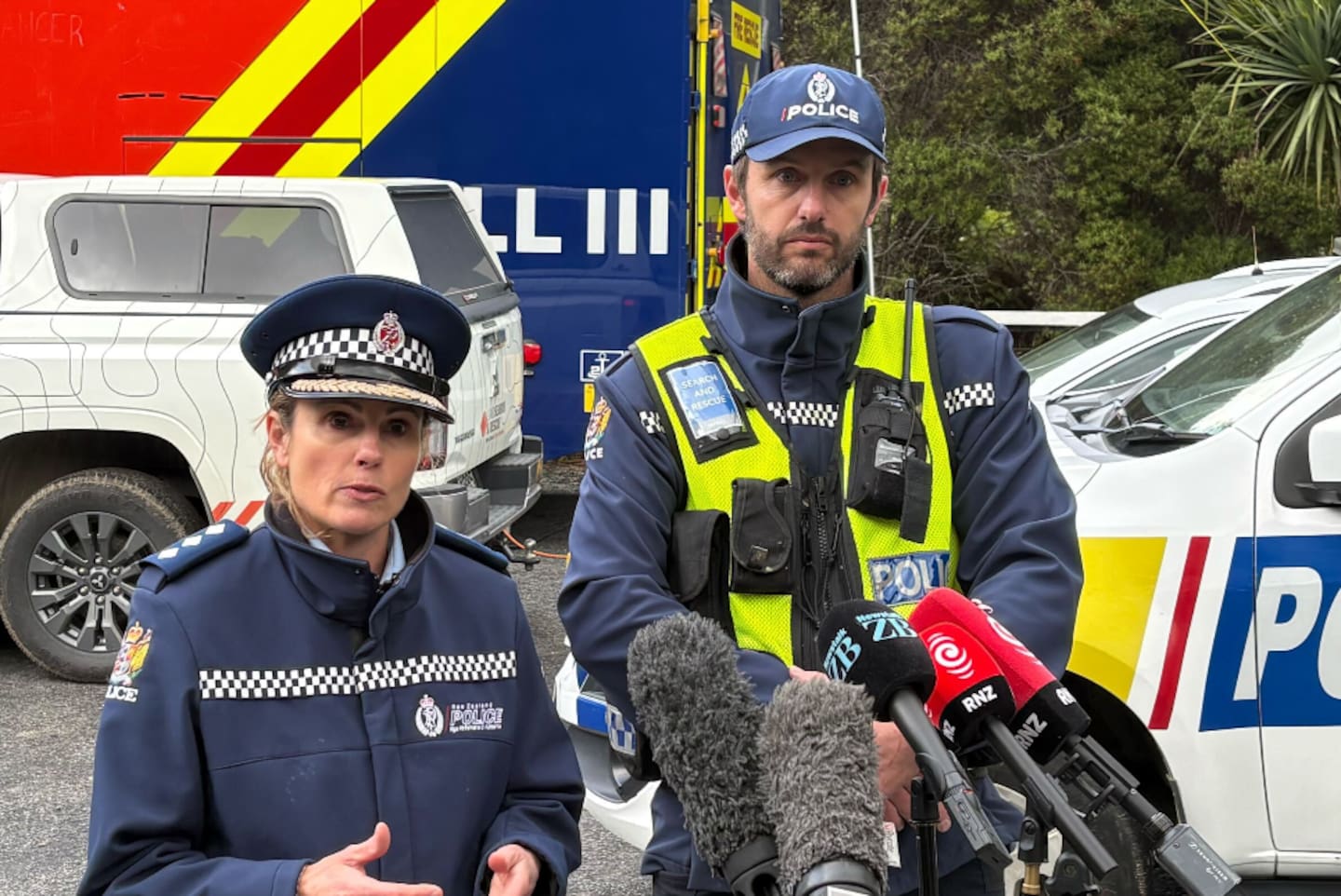 Inspector Fleur de Bes and Senior Sergeant Craig Pickering given an update at the rural Karori search scene. Photo / Tobias Macintosh