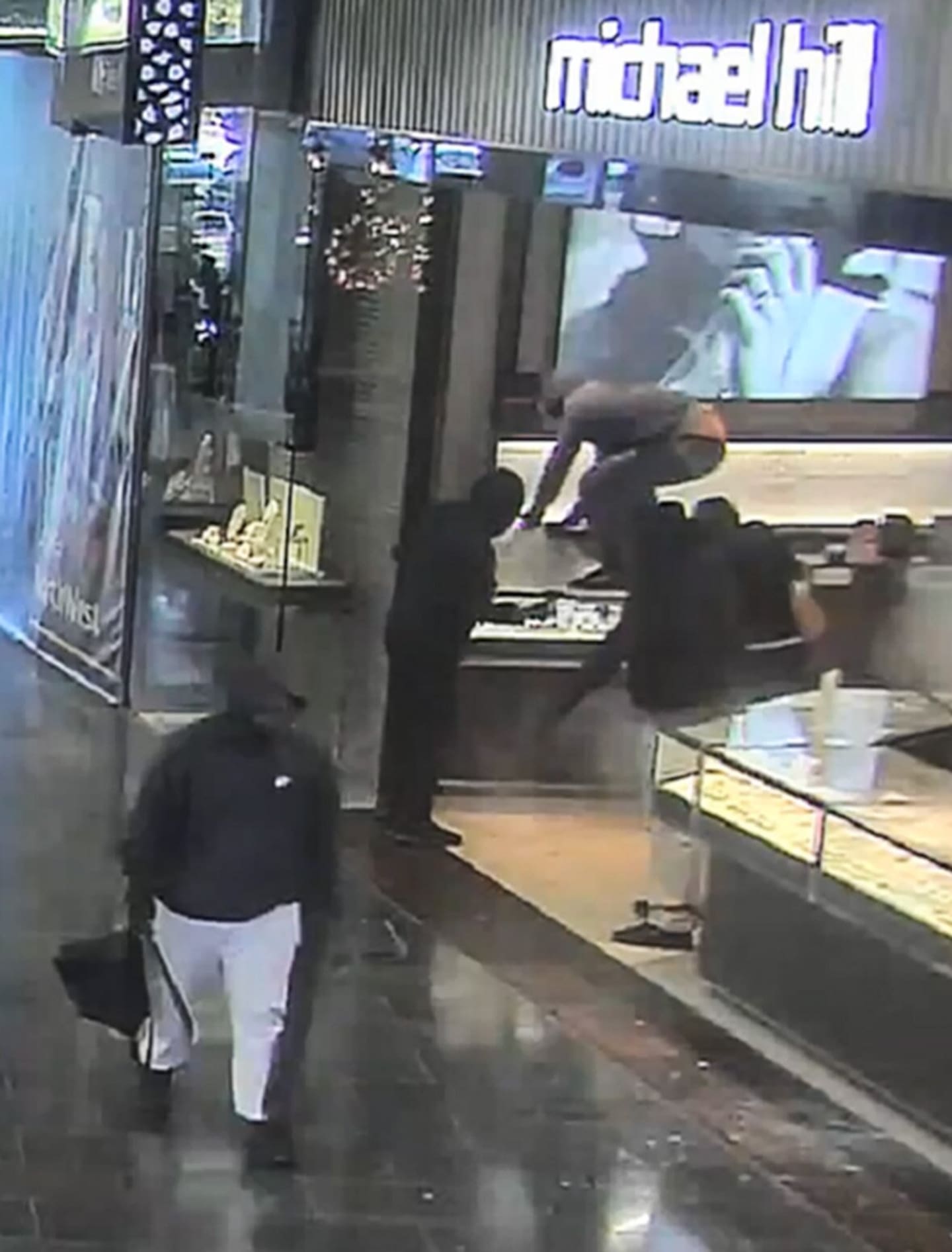 Five armed robbers clad "head to toe” in black, stormed the Michael Hill Jeweller at Westgate’s NorthWest Shopping Centre on April 28, Photo / NZ Police