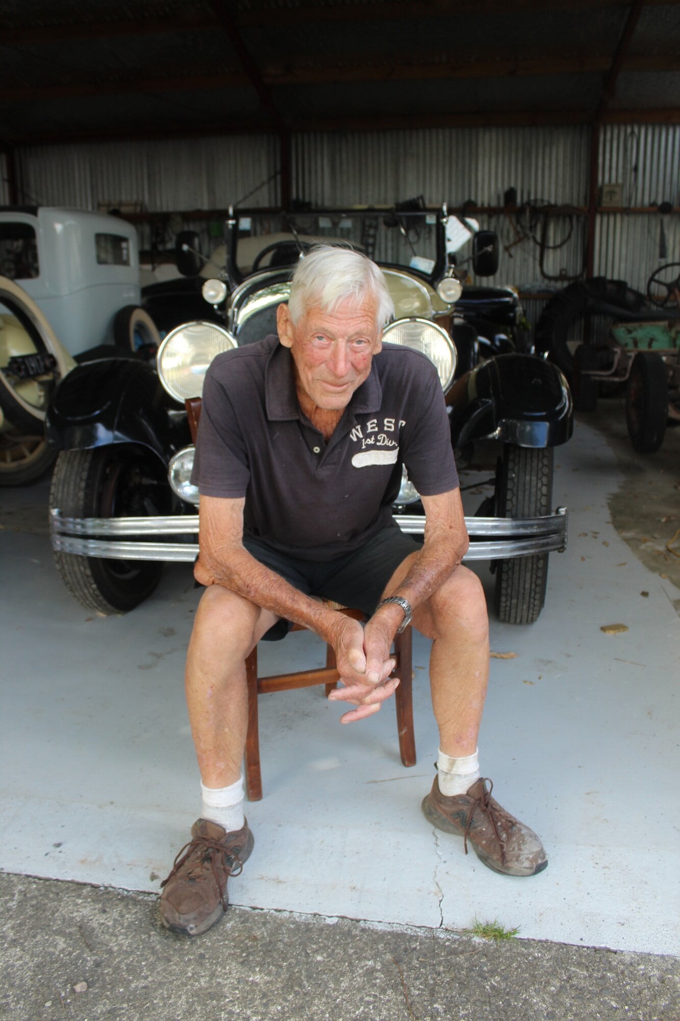 Katikati Community Patrol volunteer Murray Tom, 90, takes a break from his hobby rebuilding cars and caravans. Photo / Rebecca Mauger