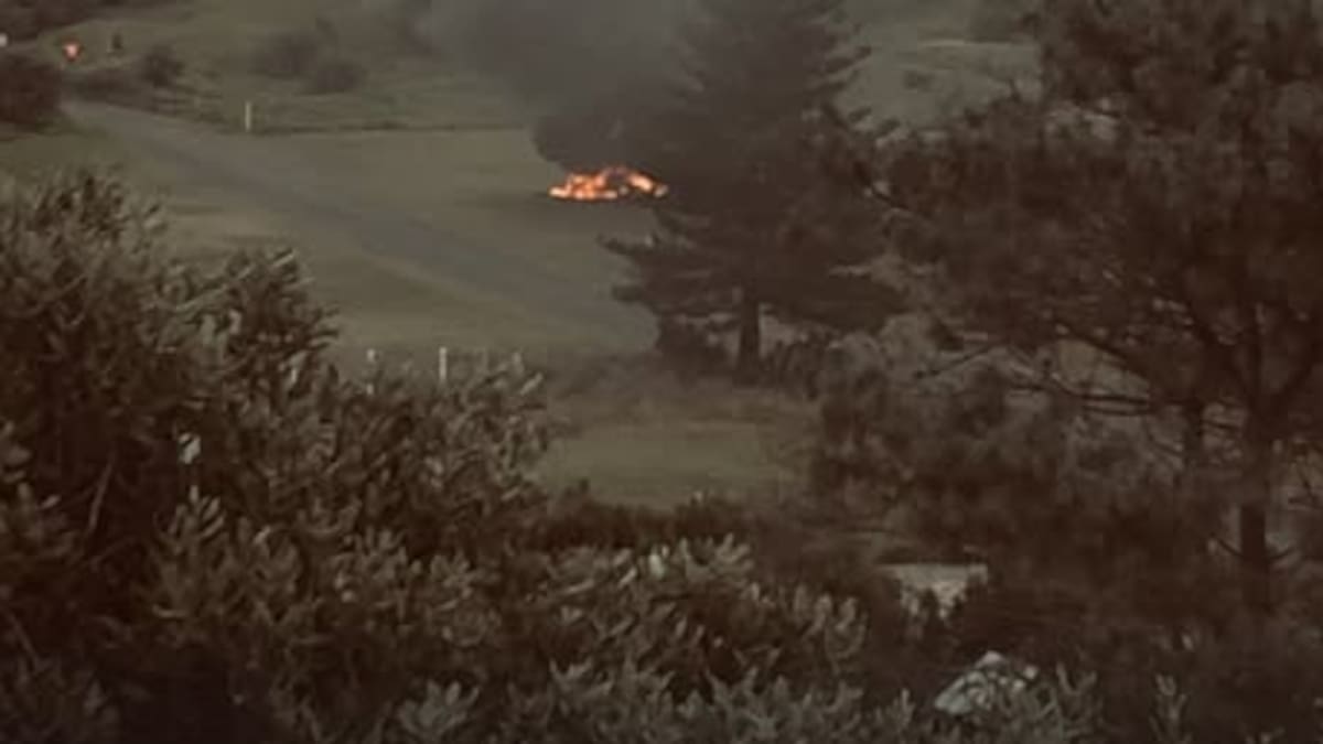 Body found beside burned-out car at Auckland beach Body found beside burned-out car at Auckland beach