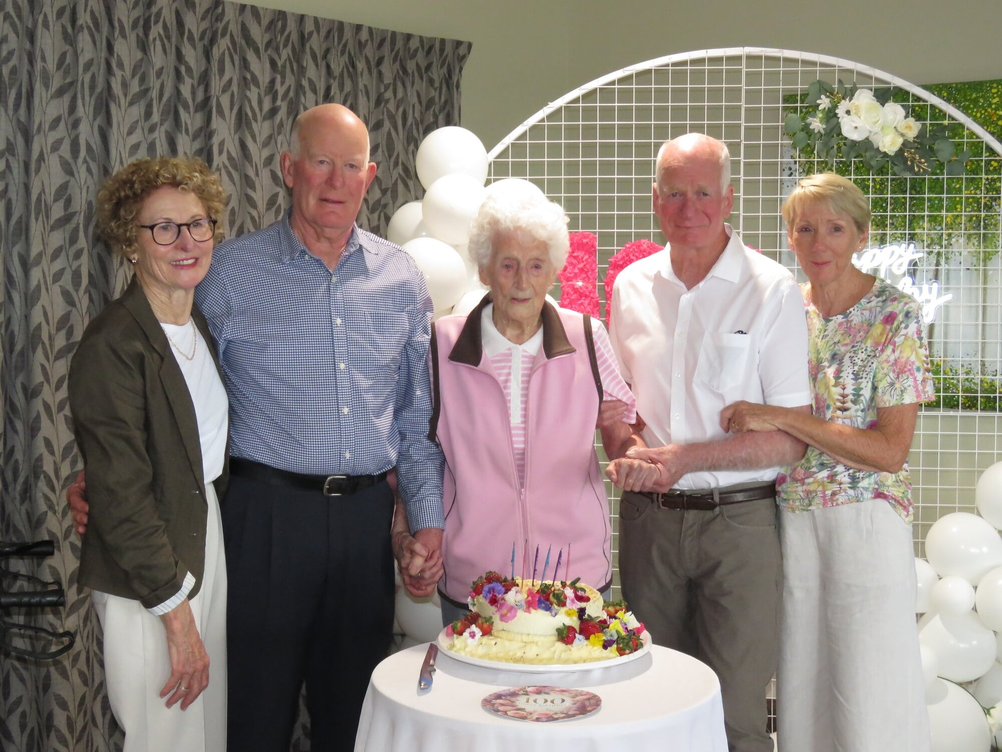 Daughter-in-law Kay Mitchell, son Trevor Mitchell, centenarian Treve Mitchell, son Ross Mitchell, and daughter-in-law Therese Mitchell. Photo / Merle Cave