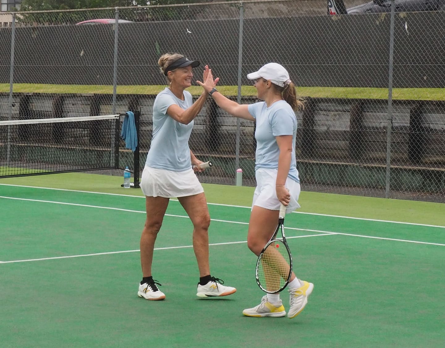 Players Frances and Bianca Coutts share a high-five. Photo / Christine Frost