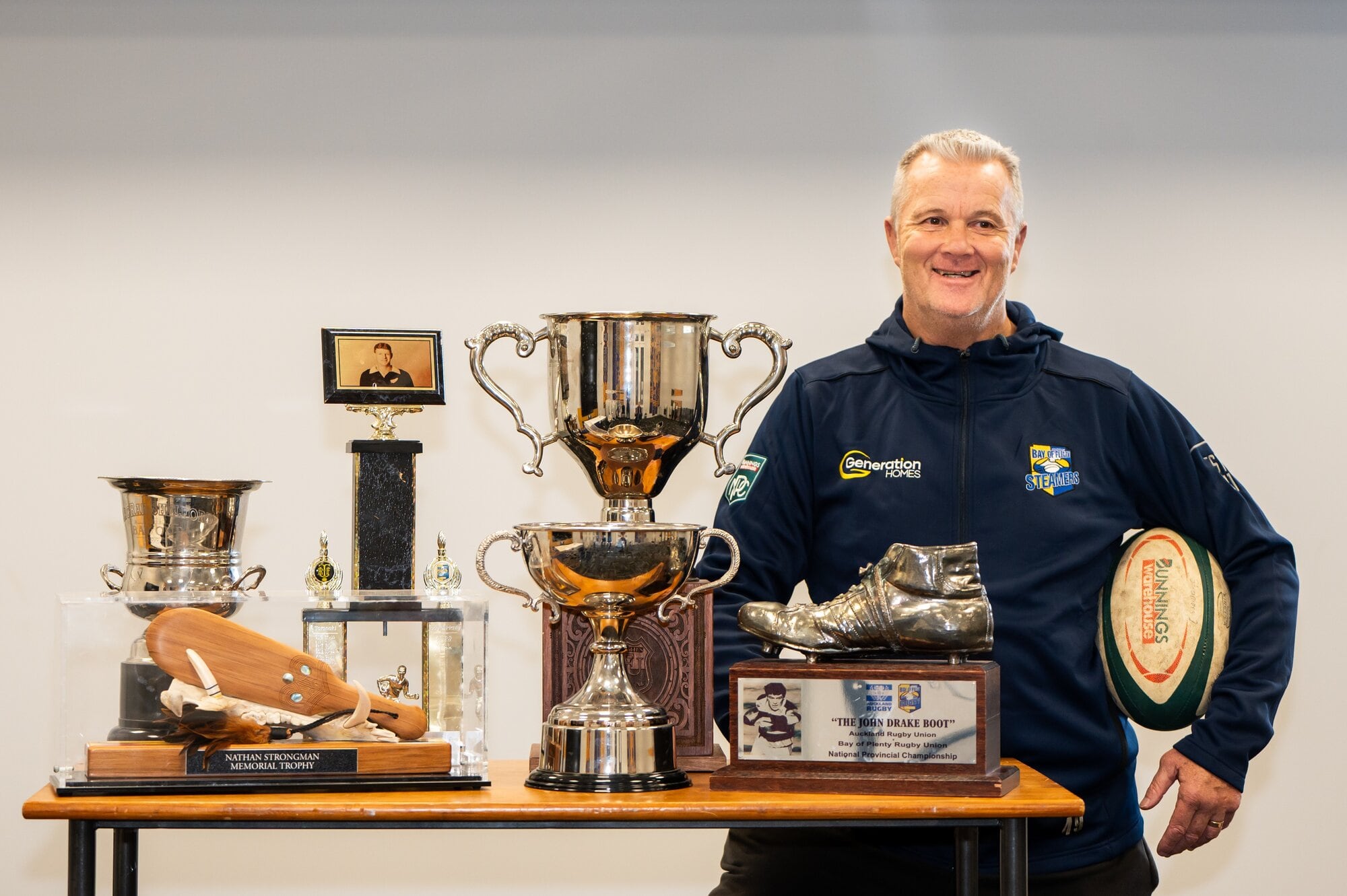 Bay of Plenty Steamers head coach Richard Watt with the six provincial trophies won in 2024. Photo / Brydie Thompson