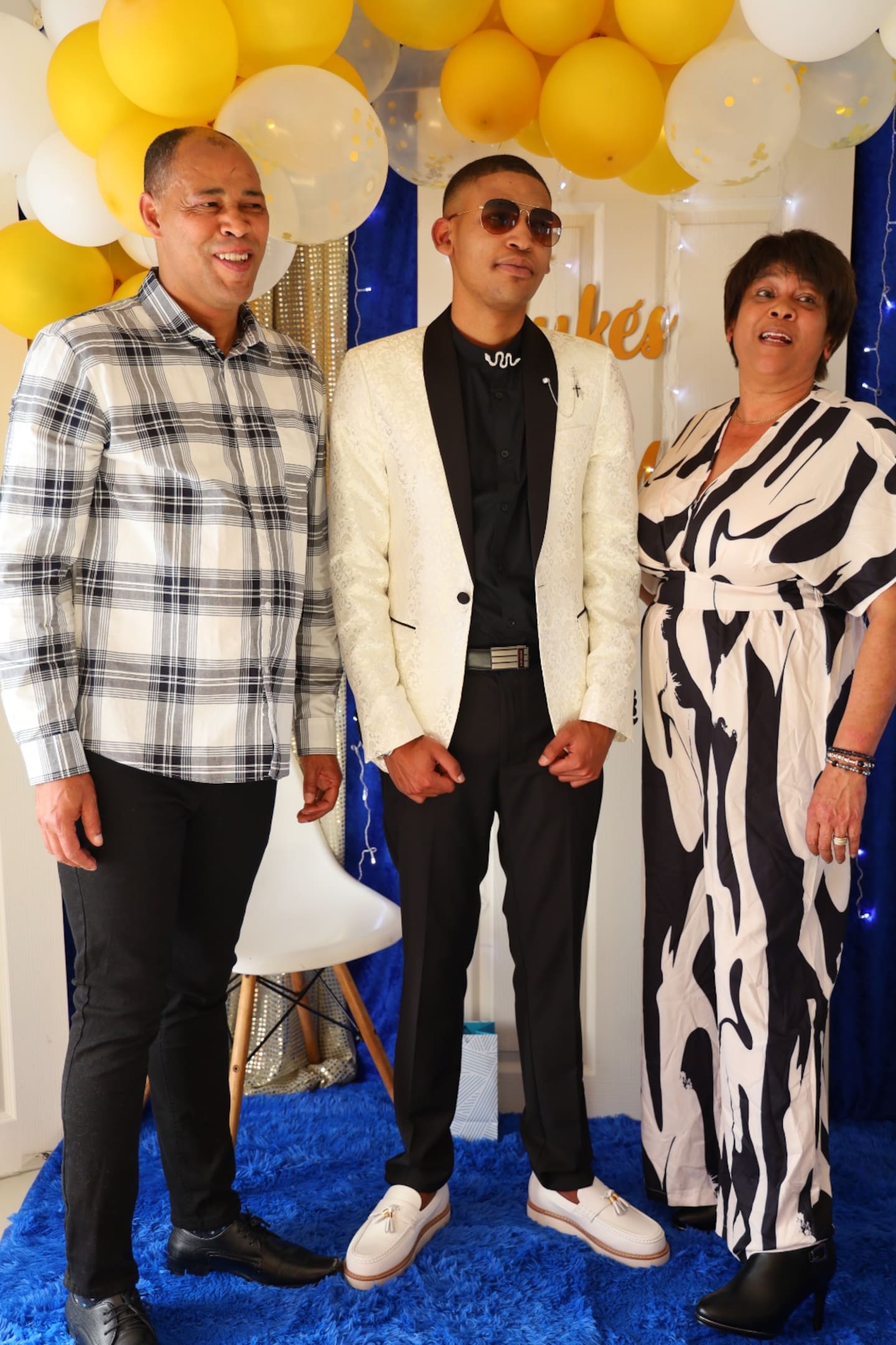 Luke Smith (centre) with parents Brian and Natasha Smith.