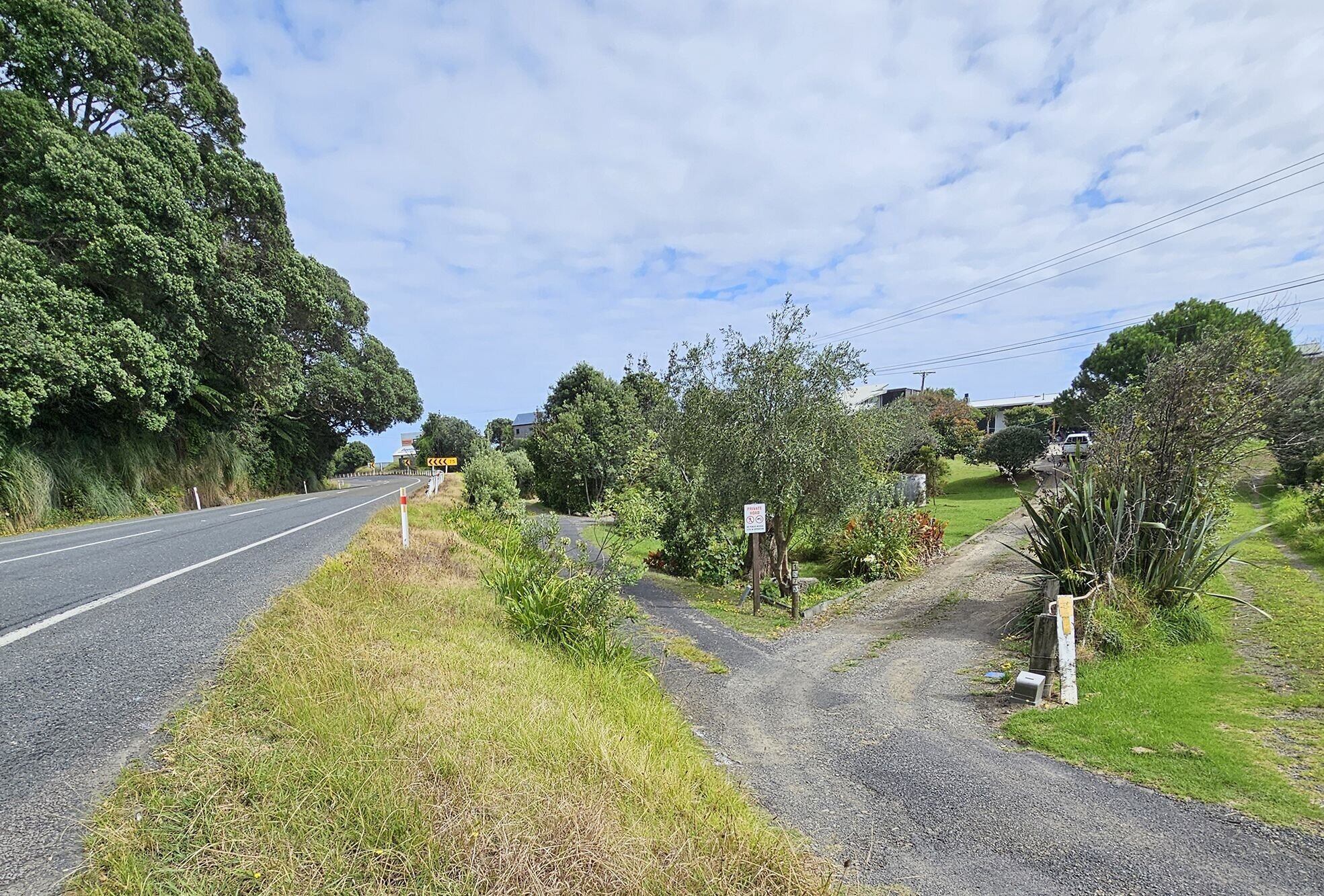 Road barriers stop short of two private properties onto which multiple vehicles have rolled after leaving the highway. Photo / Diane McCarthy