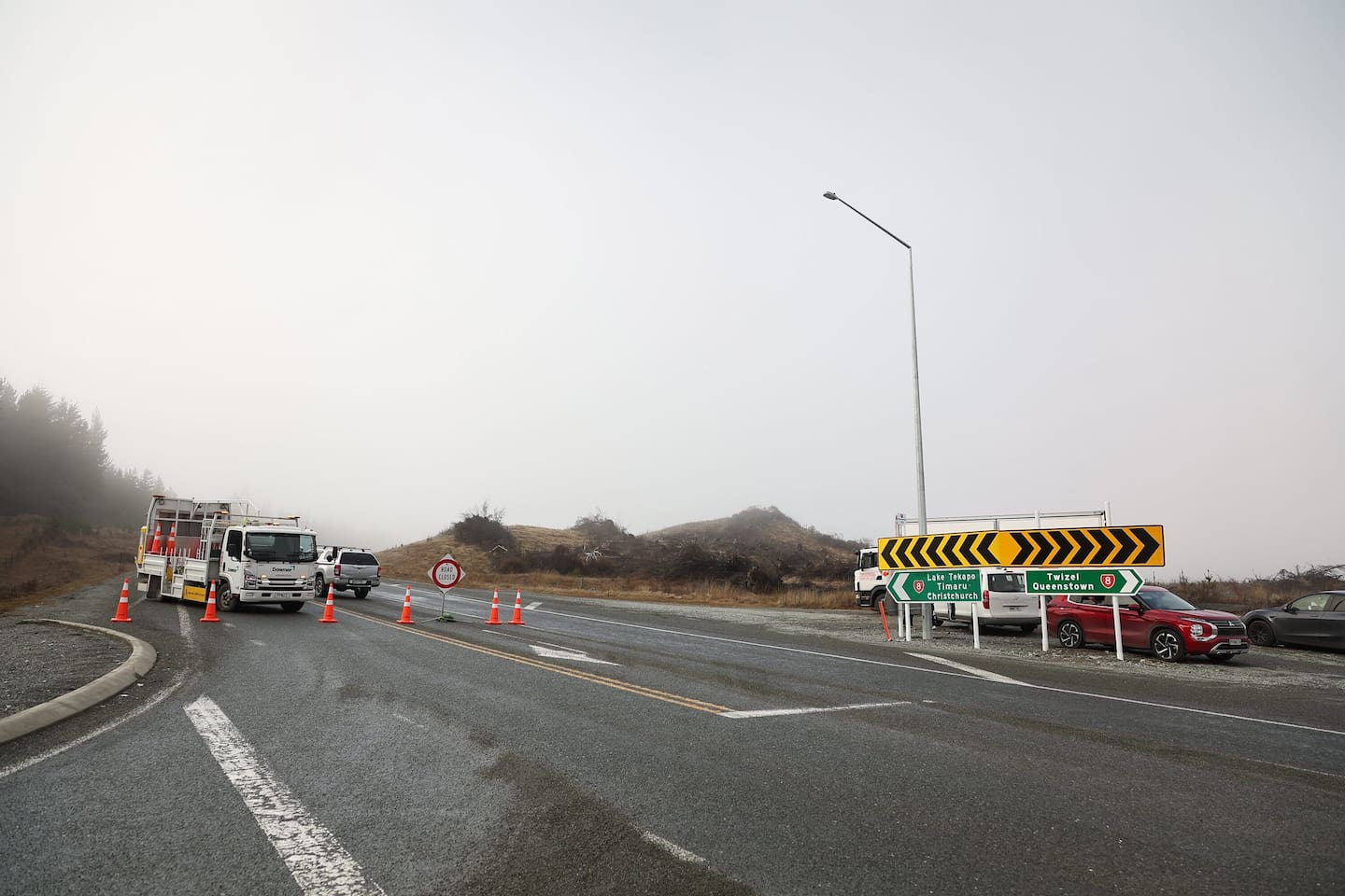 The police cordon on State Highway 8 Tekapo to Twizel Rd - the scene of two bus crashes due to weather conditions. Photo / James Allan
