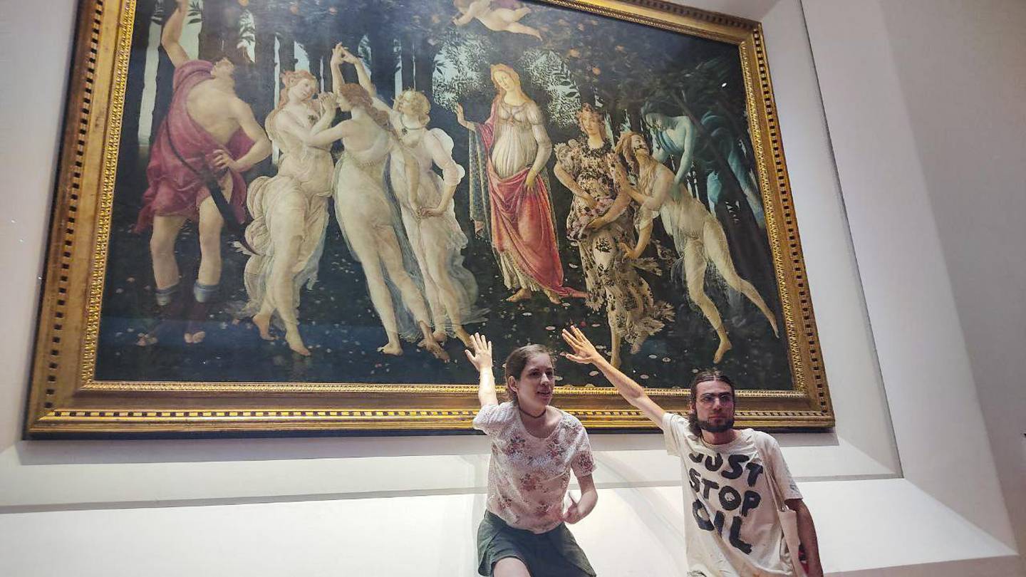 Two activists of Ultima Generazione (Last Generation) glued themselves to the glass protecting Botticelli's Primavera (Spring) in the Uffizi Gallery . Photo / Ultima Generation via AP