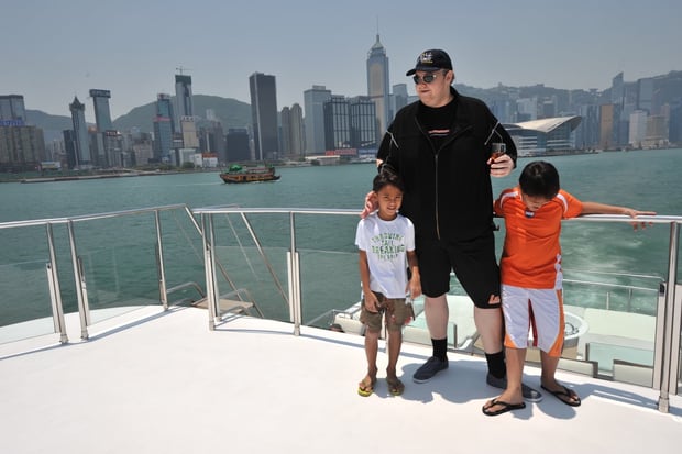 Kim Dotcom with former wife Mona's brothers, Auji and Nelvien, about 10 years ago. Photo / Supplied