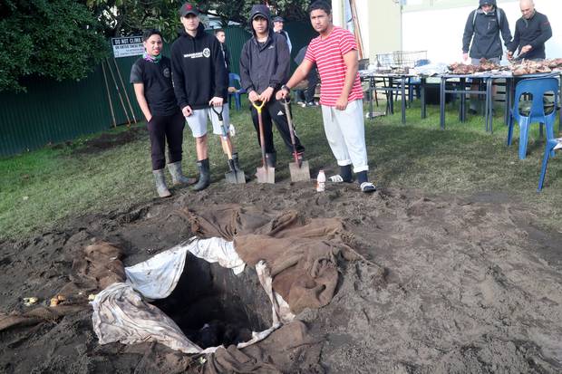 Marino Pauro, Julz Petzold-Thompson, Hikaroa Tamehana and Justin Baty all helped to put on a hāngī for Whanganui High School to celebrate Matariki. Photo / Bevan Conley
