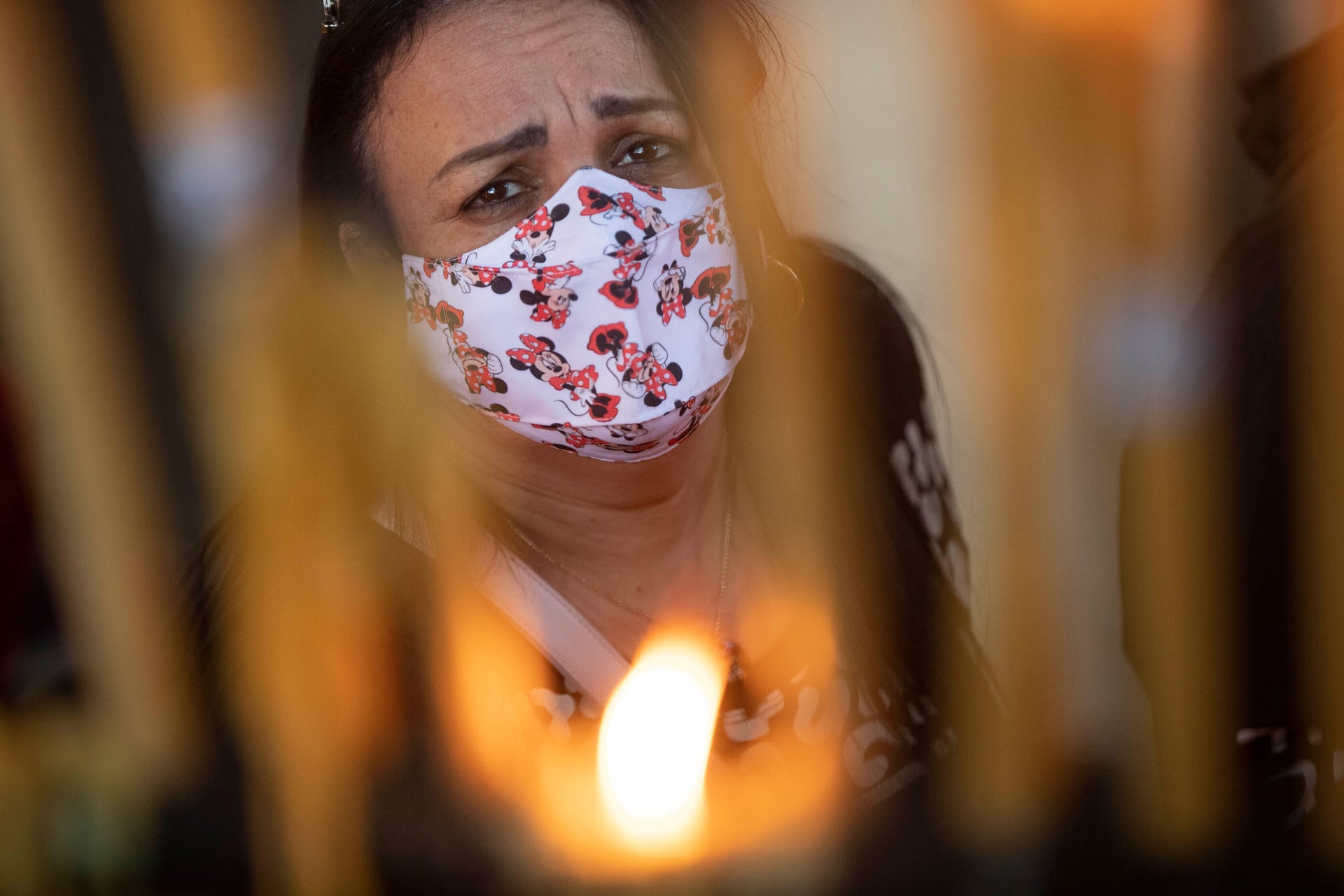A woman lights candles at Our Lady of Aparecida Basilica in Aparecida, Brazil on October 12. Photo / AP