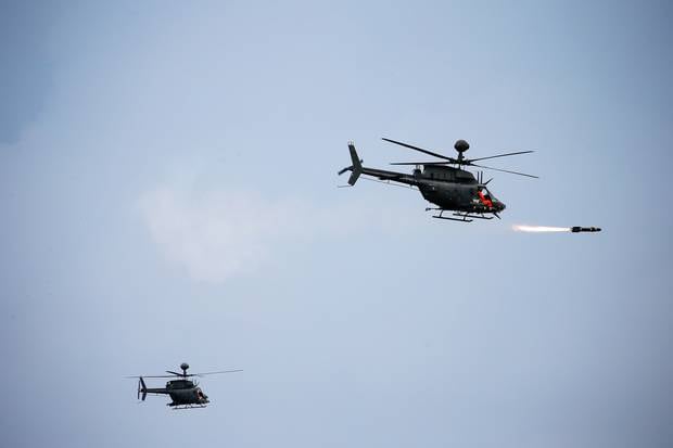 Bell AH-1W SuperCobra helicopters manufactured by Textron Inc perform a flyover during the Republic of China Armed Forces' annual Han Kuang military exercise in Taichung, Taiwan. Photo / Getty Images
