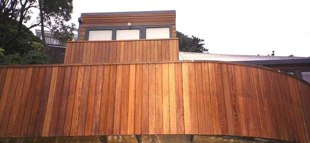 How the same house can look after the cedar is stained. Photo / File