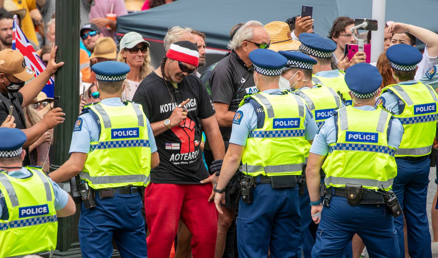 Anti-mandate protesters are held back after attempting to breach police lines at Parliament, Wellington. Photo / Mark Mitchell