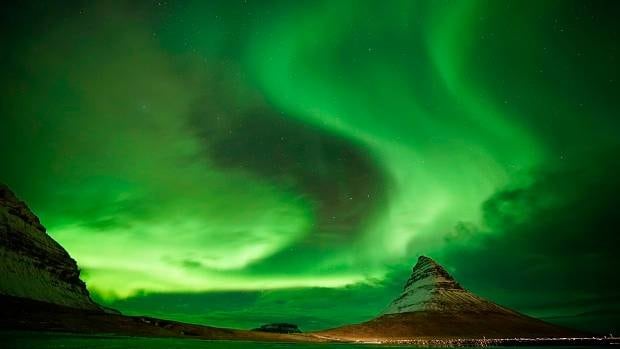 Aurora Borealis, the Northern Lights, over Kirkjufell. The aurora is caused by charged particles from the Sun being captured by Earth's magnetic field. Photo / Getty Images