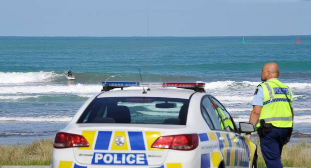 Police keeping tabs on surfers at a popular beach in Gisborne. Photo / Gisborne Herald