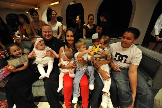 The Dotcom family Christmas in 2012. Auji Dotcom is on the sofa, third from the right in a cap. Photo / Supplied