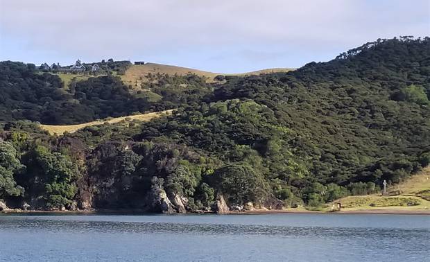 The fire-scarred hillside the following day. Marsden Cross can be seen at the right. Photo / Owen Smith