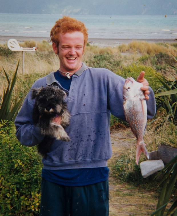 Ashley before he was institutionalised. He loves fishing and surfing.