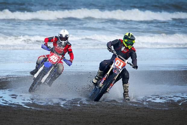 Colin Matthews, left, looking to catch up with Seton Brown at the Whanganui Beach Races this morning.