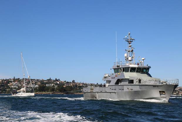 The yacht, Lafayette, was towed to Balmain by the police vessel Nemesis. Photo / AFP